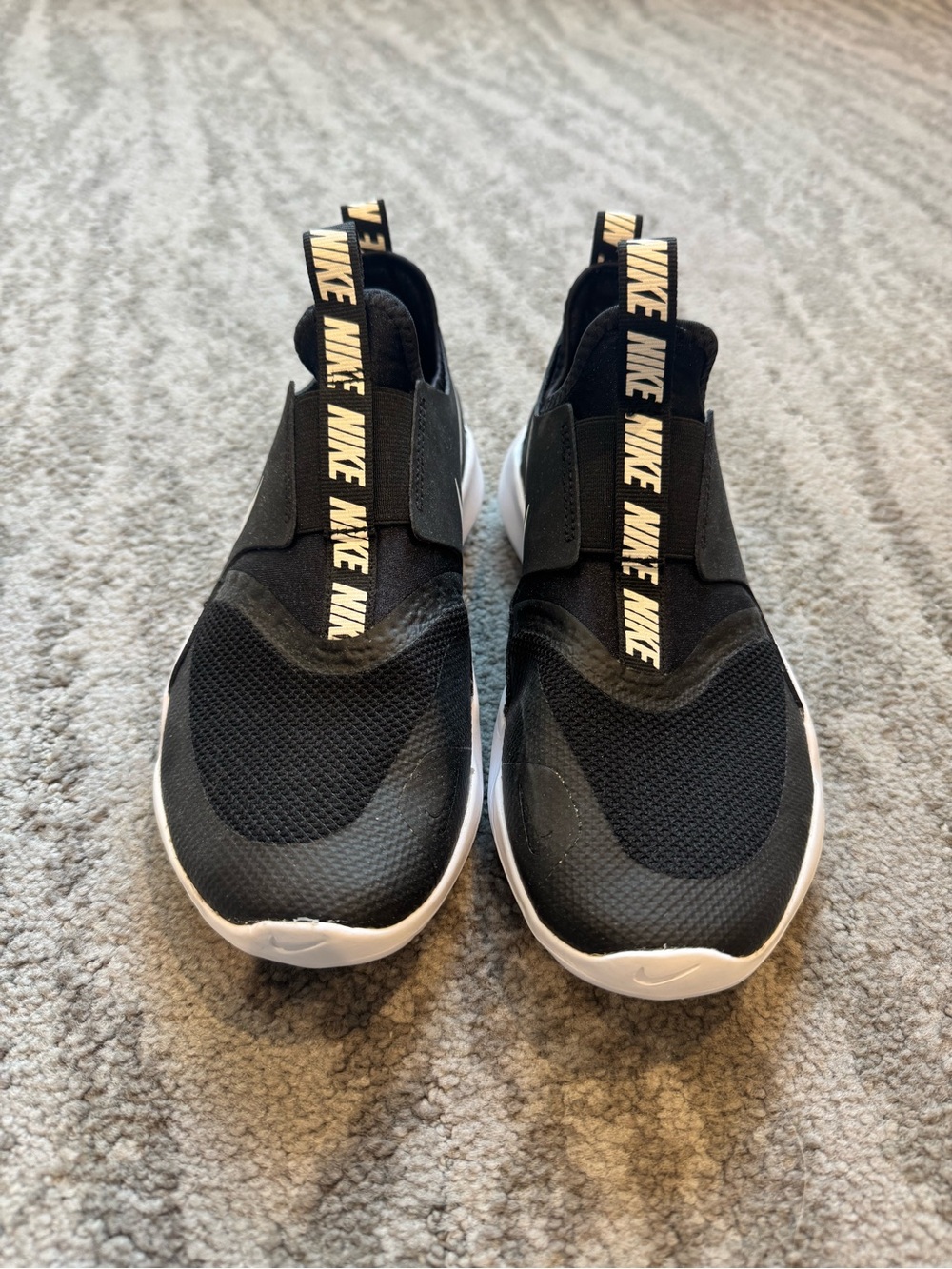Brand new Nike Kids Black Slip-On Sneakers with White Sole and Branded Pull Tabs